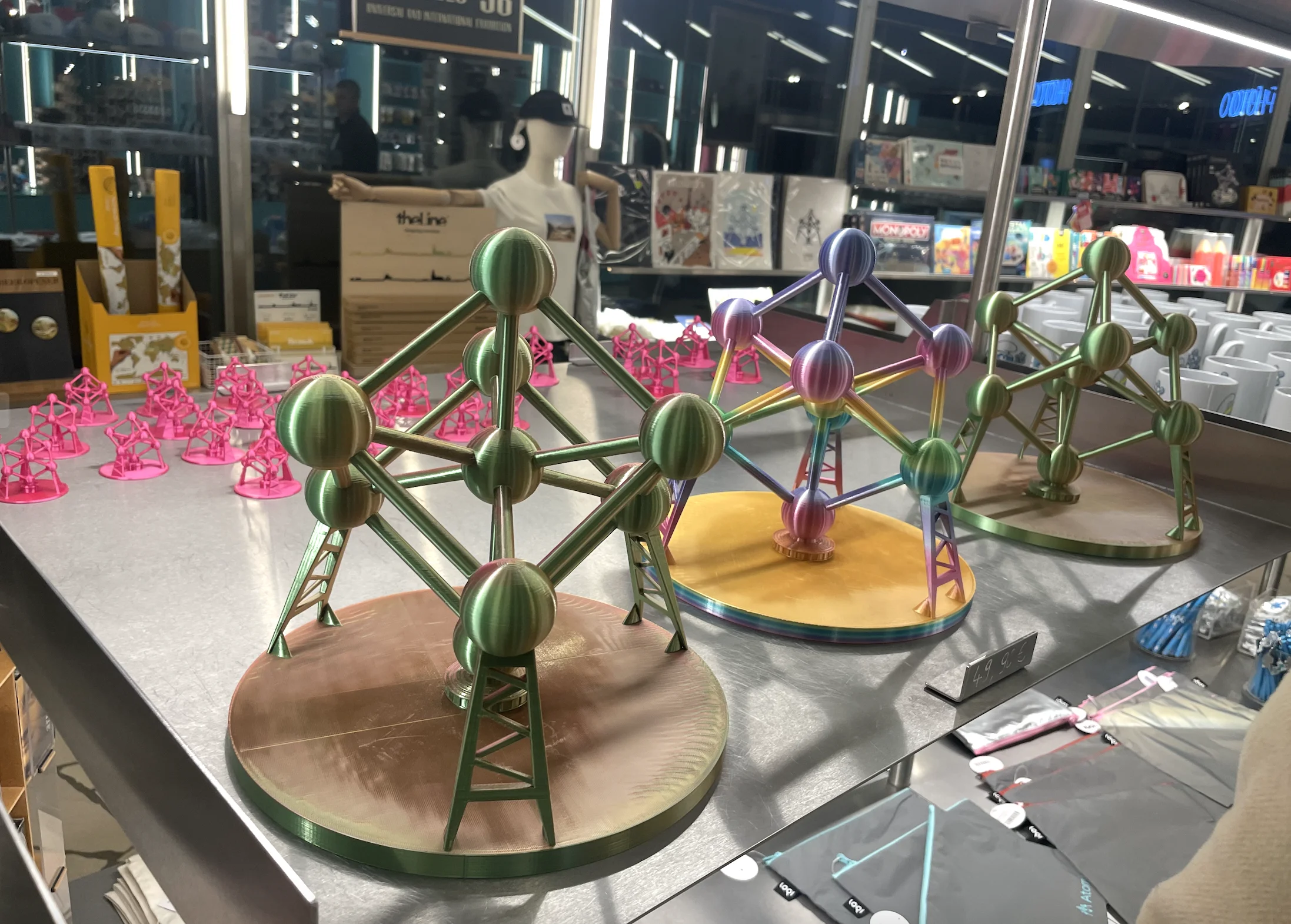 3D printed Atomium figurines display at Brussels gift shop - colorful metallic finishes